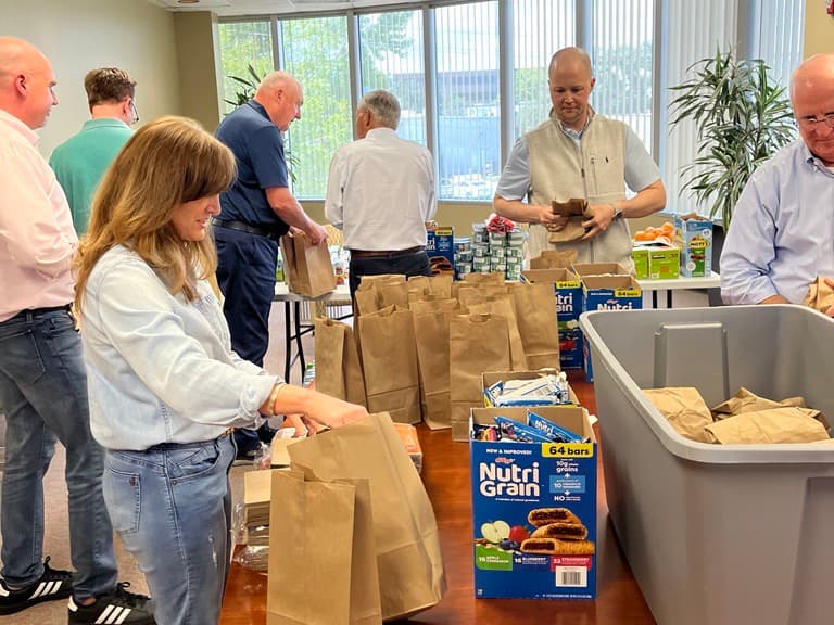 CORDA team preparing meals at Kids Meals Inc.